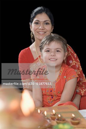 Portrait of a mid adult woman smiling with her daughter