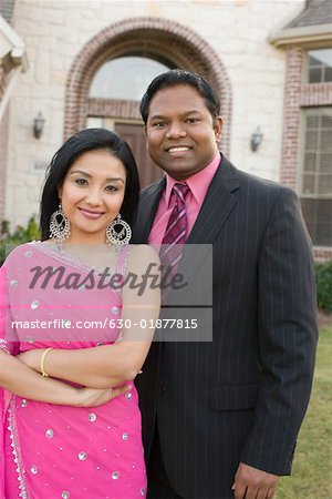 Portrait of a mid adult man smiling with a young woman