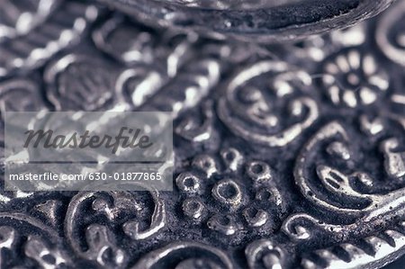 Close-up of a carved metal sheet