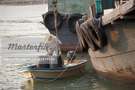Man Loading Boat, Tai O, Lantau Island, China