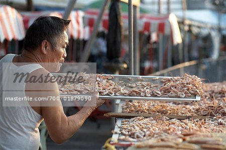 Man Laying Seafood out to Dry, Cheung Chau Island, Hong Kong, China