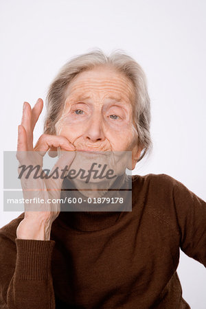 Woman Making Smoking Gesture