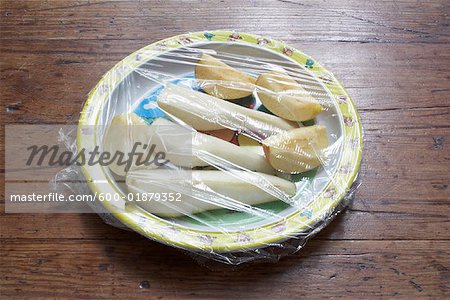 Plate of Fruit Covered With Plastic Wrap