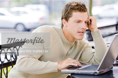 Man Using Laptop Computer Outdoors