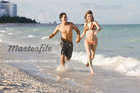 Couple Running on the Beach