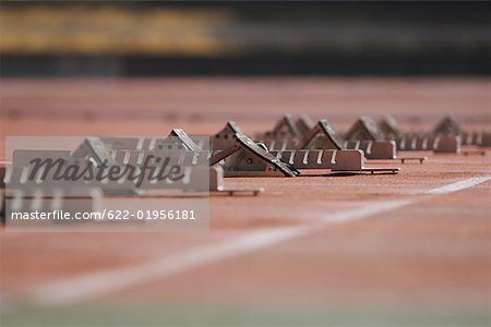 Track and field starting blocks at starting line