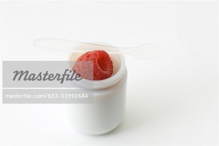 Fresh raspberry in small jar