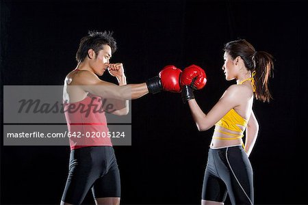 a female boxer and a male boxer