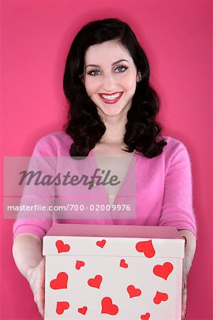 Portrait of Woman Holding Gift Box