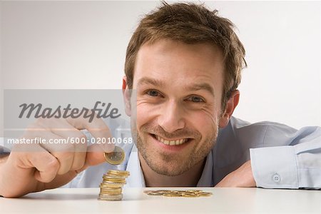 Man Counting Coins