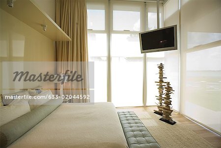 Luxury hotel room with large bed and widescreen television