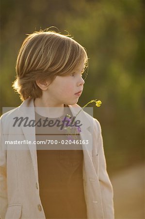 Portrait of Boy With Wildflowers, Costa Mesa, Newport Beach, Orange County, California, USA