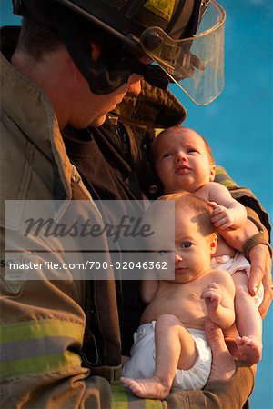 Firefighter Holding Babies