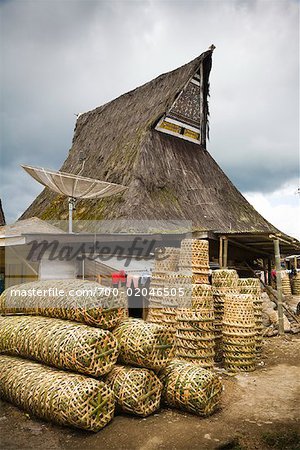 Stacks of Woven Baskets by Traditional Building, Lingga, North Sumatra, Indonesia