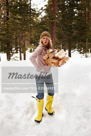 Woman Posing and Carrying Firewood