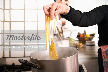Woman cooking pasta