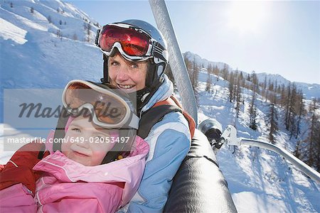 Young girl and grandmother on chair lift