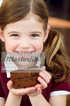 Girl holding an chocolate cake