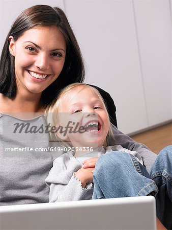 Mother and daughter smiling