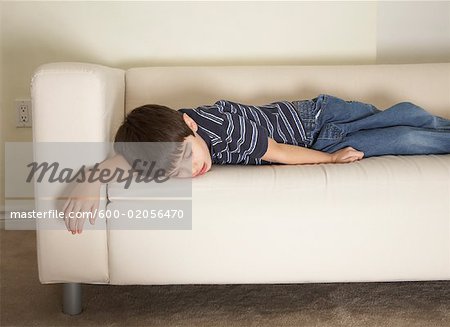 Boy Napping on Sofa