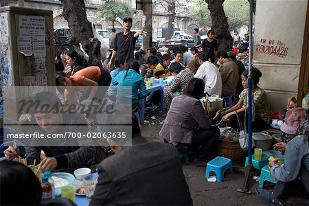 Group Eating Together in City, Hanoi, Vietnam