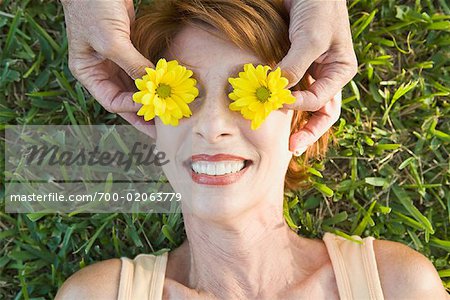 Flowers Covering Woman's Eyes