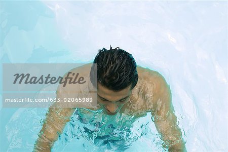 Man in swimming pool, high angle view