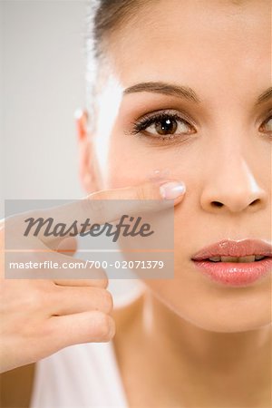 Portrait of Woman Putting in Contact Lenses