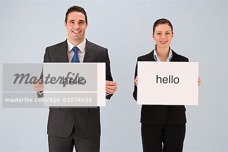 Colleagues holding hello signs