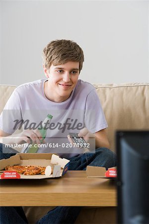 A young man watching tv