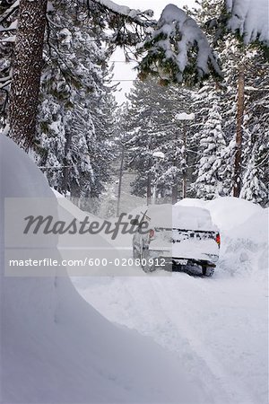 Truck Driving on Snowed in Road