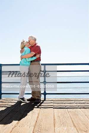 Couple Kissing on Boardwalk, Santa Monica Pier, Santa Monica, California, USA