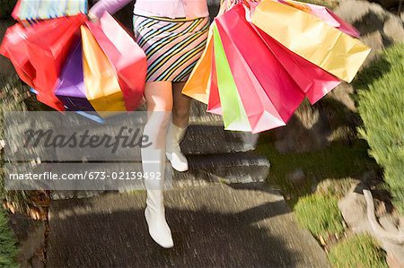 Woman carrying several shopping bags