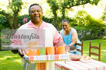 Man carrying drinks for picnic