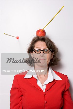 Shooting an apple off businesswoman's head