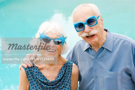 Senior couple in wacky sunglasses