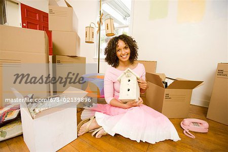 Woman unpacking boxes in new home