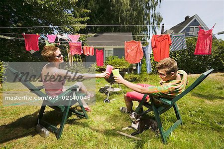 Couple toasting in back yard