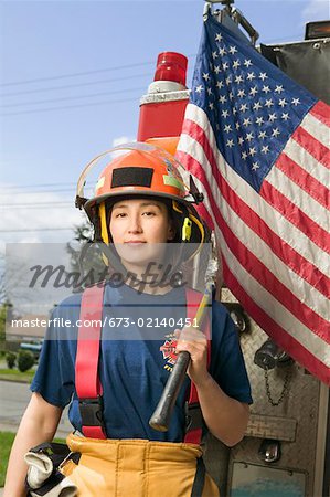 Female firefighter with American flag