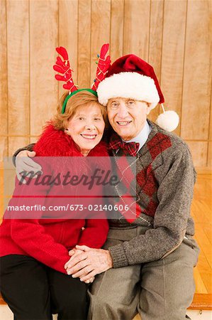 Portrait of elderly couple at Christmastime