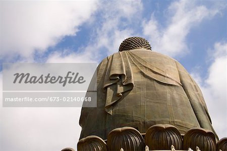 View of back of Buddha statue and sky