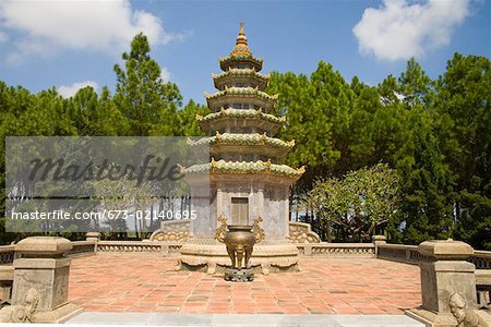 Vietnamese pagoda on terrace with trees