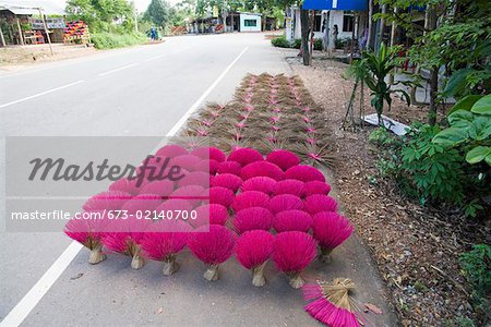 Bundles of incense along Vietnamese road