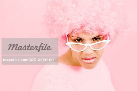 Woman wearing pink wig and eyeglasses