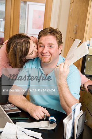 Woman kissing her husband on the cheek