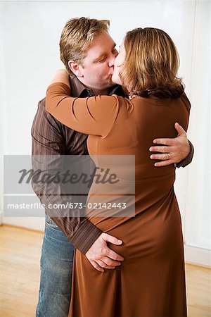Man kissing his wife