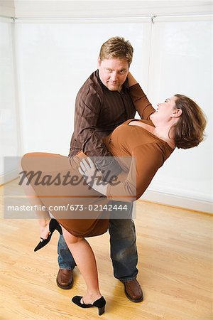 Couple dancing in living room