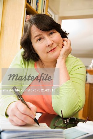 Woman writing a check