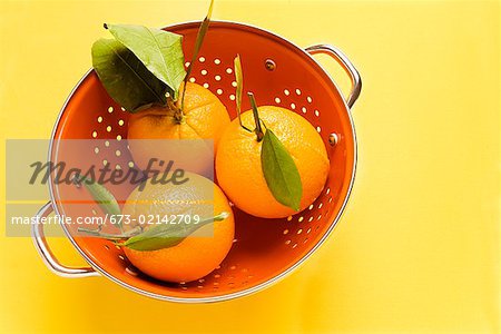 Oranges in colander