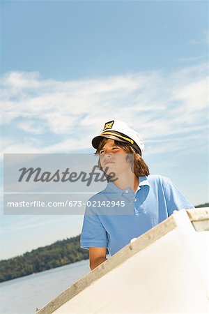 Boy wearing ship captain’s hat